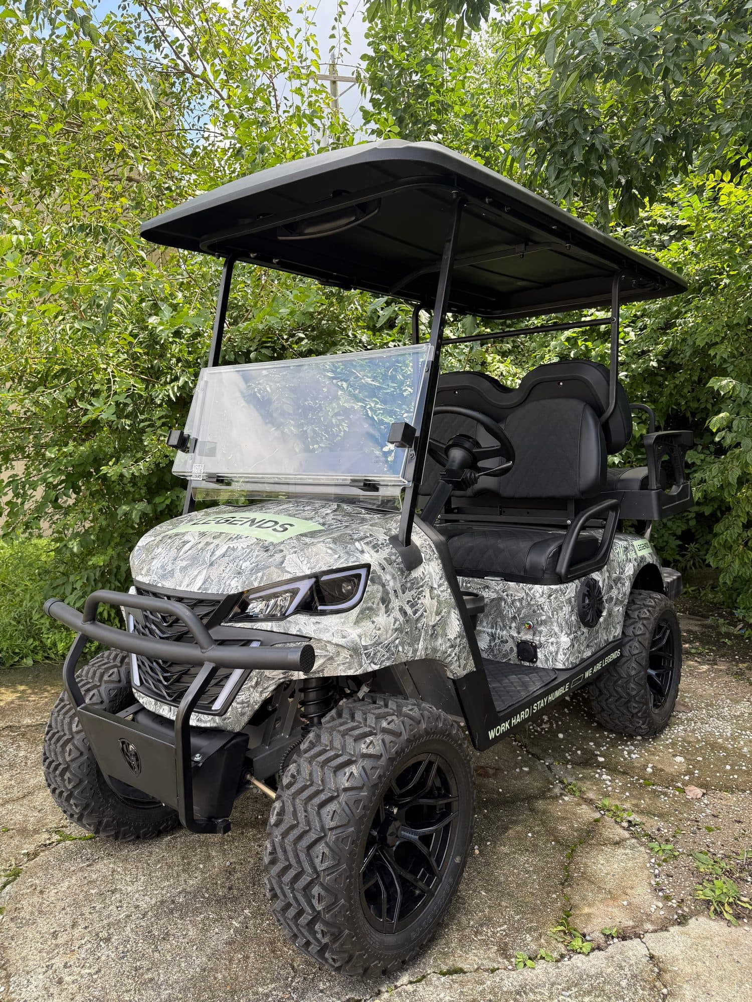 EA Carts golf cart in a gray and white custom camo wrap with a Legends decal and black seats